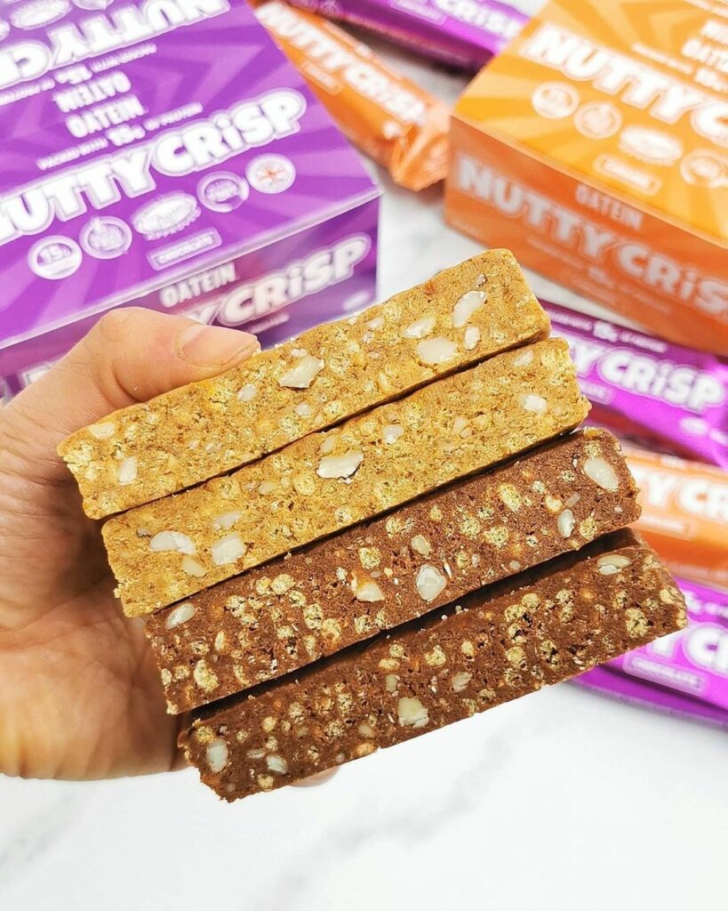 Two sliced nut vegan protein bars in caramel and chocolate flavours